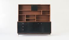 a black and brown bookcase with two drawers