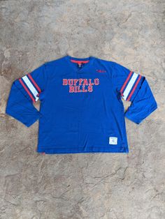 Vintage 90's Buffalo Bills Gridiron Classic Long Sleeve Tshirt. Has fading, pilling and other wear. NO holes. In good vintage condition... Ready To Wear Size XL. Measurements: Pit to Pit: 24 1/2" Collar to Bottom: 27 3/4" Pit to End of Sleeve: 21" Buffalo Bills Thanksgiving Shirt, Throwback Long Sleeve T-shirt For Sports Events, Throwback Long Sleeve T-shirt For College, Throwback Long Sleeve T-shirt For Streetwear, 90s Style Long Sleeve Top For Sports Events, Throwback Long Sleeve Letter Print T-shirt, Vintage Cotton Tops For Sports Events, Vintage Fan Gear Tops With Crew Neck, Vintage Crew Neck Tops For Fan Gear