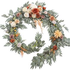 a wreath made out of flowers and greenery on a white background with the letter o