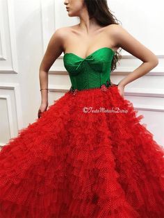 Details - Green and red color  - Designer tulle fabric  - Handmade corset  - Ball gown style with waist definition - For special occasions Elegant Tulle Ball Gown For Christmas, Elegant Christmas Tulle Ball Gown, Red Tulle Dress For Red Carpet, Elegant Tulle Dresses For Red Carpet, Sleeveless Ball Gown For Christmas Wedding, Red Fitted Bodice Organza Dress, Party Ball Gown With Sweetheart Neckline And Tulle Skirt, Red Fitted Organza Ball Gown, Red Tulle Evening Dress For Gala