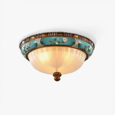 a ceiling light with blue and gold designs on the glass shade, against a white background