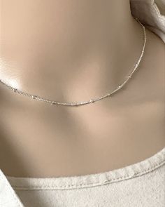 "Sterling Silver Satellite Chain Choker Necklace Beaded Minimalist and Dainty Necklace Simple, Everyday Necklace Metal: All components are made from Solid .925 Sterling Silver Necklace is adjustable **Choose Chain Length At Checkout** 14\"+2\"Ext 15\"+2\"Ext 16\"+2\"Ext Pictures Photographed at 15\" Please feel free to Convo me with any questions before purchasing. You can find other Dainty Minimalist Jewelry in my Shop here https://www.etsy.com/shop/LinksAndStones?ref=seller-platform-mcnav& Daily Wear Silver Chains For Women, Adjustable Silver Beaded Necklace With Delicate Chain, Silver Minimalist Beaded Necklace With Short Chain, Minimalist Silver Beaded Necklace With Clavicle Chain, Everyday Silver Beaded Necklace With Delicate Chain, Silver Beaded Necklaces With Adjustable Chain, Silver Beaded Necklace With Adjustable Chain, Sterling Silver Beaded Chain Necklace For Everyday, Minimalist Tiny Beads Chain Necklace For Everyday