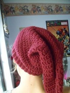 a woman wearing a red knitted hat