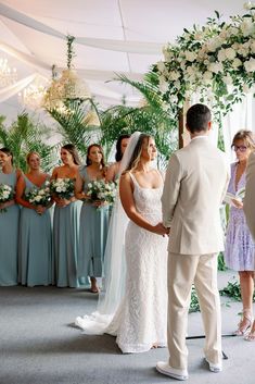 the bride and groom are getting married in front of their guests at this wedding ceremony