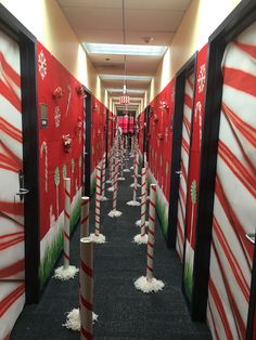 an office hallway decorated with candy canes and christmas themed decorations for the holiday season