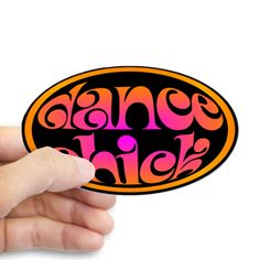 a hand holding an orange and pink sticker with the word dance high on it