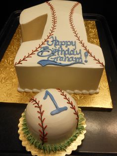 a birthday cake with a baseball and number one on it