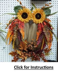 an owl made out of fake leaves and sunflowers with the words click for instructions