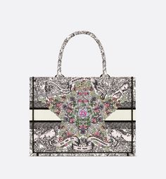 Introduced by Maria Grazia Chiuri, Creative Director of Christian Dior, the Dior Book Tote has become a staple of the Dior aesthetic. Designed to hold all the daily essentials, the latte style is fully embroidered with Pietro Ruffo's multicolor Dior Around the World motif, showcasing a star decorated with flowers in honor of Scottish heritage, the collection's hallmark theme, and an allegory of the senses with a Marie Stuart quote: En ma fin est mon commencement (In my end is my beginning). Ador Marie Stuart, Dior Aesthetic, Dior Book, Christian Dior Paris, Dior Paris, Dior Book Tote, Maria Grazia Chiuri, Perfume Design, Maria Grazia