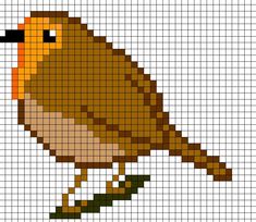 a cross stitch bird sitting on top of a tree branch