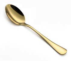 a golden spoon with a black handle on a white background