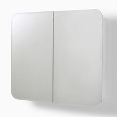 a white mirror mounted to the side of a wall