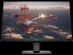 a computer monitor with an image of a pirate ship in the ocean on it's screen