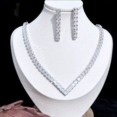 A beautiful three-piece bridal jewelry set that will add elegance and sophistication to any wedding gown or formal ensemble! Adorned with intricately faceted cubic zirconia that capture the light from every angle with a perfectly translucent appeal, the pieces are platinum / 14K yellow gold plated for a flawless finish which enhances the intricate detailing and conveys a modern take on old elegance. Necklace: 17.7" (approx. 45cm) long with a secure fold-over closure (a 2" extension chain can be