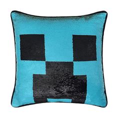 a blue pillow with black squares on it