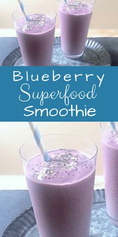 blueberry superfood smoothie in three glasses with straws on the side