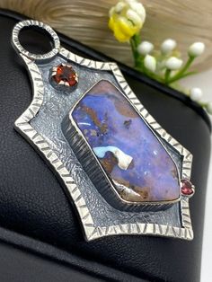 "Australian Boulder Opal pendant in sterling silver Hand-made Sterling Silver 925 Stones used: Australian Boulder Opal, High Qualty Citrine Height - 2 1/4\" (with bail), Width - 1 1/4\" Unique Handcrafted One-of a-kind Design Pendant Each Piece of Jewelry in my Collection is Absolutely One of a Kind! When you start wearing a piece of my jewelry you will fall in love with it more and more each day and feel that good Energy and Love that I pass into it while creating this piece of Art. A piece of Artisan Pendant Necklaces Stamped 925, Artisan Pendant Necklace Stamped 925, Artisan Necklace With Stamped 925 Pendant, Artistic Hand Forged Sterling Silver Necklace, Unique Stamped 925 Round Pendant Jewelry, Hand Forged Sterling Silver Necklace With Rectangular Pendant, Artistic Hand Forged Sterling Silver Jewelry, Artisan Hand Forged Oval Pendant Jewelry, Artistic Sterling Silver Necklace With Oval Pendant