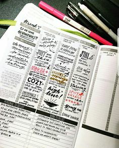 an open book with writing on it and some pens in front of it, sitting on a desk