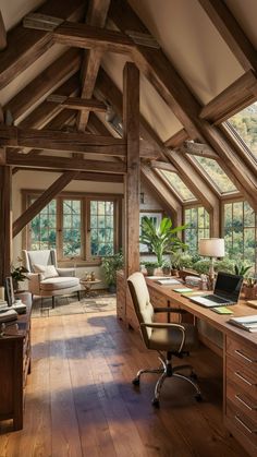 an attic office with wooden floors and vaulted ceiling, large windows on the far wall