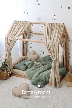 a child's bedroom with a canopy bed and polka dot wallpaper