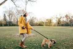 a man walking his dog in the park