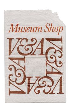 a piece of paper with the words museum shop and numbers printed in brown on it