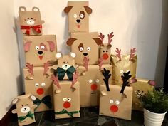 there are many brown bags that have reindeer faces on them and bows around their necks