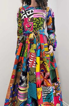 African Printed Long-Sleeve Patchwork Dress with belt     Zip at the back     Round neck     2 open side-entry pockets     With belt     Exact length from the shoulder to the bottom 61" / 156 cm     100% wax cotton     Handmade     Made in UK Due to the nature of Patchwork design, every dress is unique and colour and pattern on individual patches may differ from the photos shown. (Colours may vary due to lighting on images. The product images are closest to the true colour of the product.) Handmade Uk, Full Length Dress, African Print Fabric, Patchwork Dress, Long Sleeve Maxi, Patchwork Designs, Waxed Cotton, Dress 100, Printed Fabric