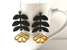 These beautiful Matisse inspired yellow flower laser cut wood earrings make a statement!  Perfect to go with any outfit. The plant shapes are laser cut out of lightweight wood and measure 30mm by 55mm. You can choose surgical stainless steel hooks or solid sterling hooks. Lightweight earrings with a bold vibe! To prolong the wear of the wood, take the earrings off when submersing into water. Acrylic Laser Cut Earrings, Wood Earrings Cricut, Laser Wood Earrings, Laser Cut Earrings Wood, Laser Cut Wood Projects, Laser Cut Wood Jewelry, Wood Leaves, Laser Cut Necklace, Concord Nh