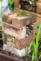 several bricks stacked on top of each other in a garden