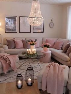 a living room filled with furniture and a chandelier