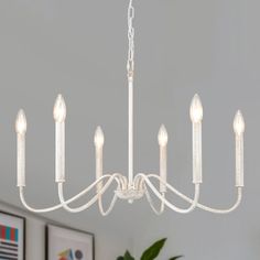 a white chandelier hanging from the ceiling