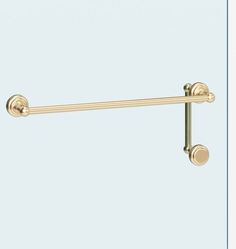 an image of a gold towel bar with two round knobs on the end and one ball in the middle