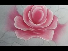 a pink rose is painted on a white canvas