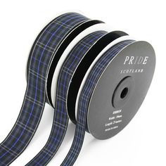 three rolls of black and blue plaid ribbon on a white background with the words pride scotland