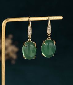 Handmade Genuine Green Jade Donut Earrings,18K Gold Plated Jade Earrings, Burmese Jade Earrings,Jade Dangle Earrings,Gift For Women Pendant Material: Hetian Jade The Hetian jade is the meaning of holding back peace and keep happiness. The natural Hetian jade can let your skin become smooth and good for your health. Notice: All the products are photographed under natural light, and what you see is the real thing. However, due to different monitors and other reasons, the color you see in the picture may be a little different compared with the real thing. Due to different measuring instruments. The product may have an error of 1-2 cm, please understand. Since we are purely handmade, there may be measurement errors in the measurement process. If you want an accurate size, please contact us or Affordable Jade Round Bead Earrings, Green Jade Earrings, Elegant Green Drop Earrings, Elegant Green Danglers As Gift, Elegant Green Danglers As A Gift, Elegant Green Danglers For Gift, Gold Jade Wedding Earrings, Jade Gemstone Drop Earrings, Jade Dangle Earrings For Pierced Ears