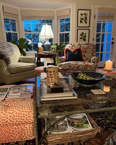 a living room filled with furniture and lots of windows