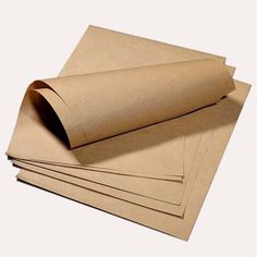 several pieces of brown paper stacked on top of each other