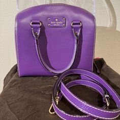 Kate Spade Purple Leather Tophandle Satchel W/ Strap Removable Strap Dust Bag Handheld Purple Leather Satchel, Purple Top Handle Satchel With Adjustable Strap, Purple Crossbody Satchel With Gold-tone Hardware, Purple Leather Satchel With Handles, Purple Leather Satchel With Detachable Strap, Elegant Purple Satchel With Adjustable Strap, Elegant Purple Bags With Leather Handles, Kate Spade Leather Satchel With Handles, Purple Handheld Satchel With Detachable Strap