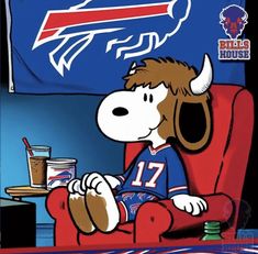 a cartoon dog sitting in a red chair next to a buffalo football logo on the wall