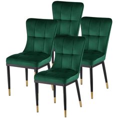 three green velvet dining chairs with gold legs