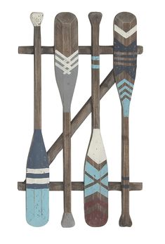 an assortment of paddles mounted to a wooden rack with two oars on each side