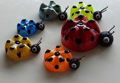 six different colored ladybugs sitting on top of each other