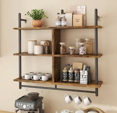 a shelf with coffee cups, mugs and other items on it next to a toaster