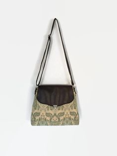 "A large tapestry shoulder or cross body bag made from a luxurious feeling heavy weight fabric with a woven design in a vintage style. The bag is lined with quilting weight cotton with  faux leather strap and flap.  This bag features a large main pocket with an internal zipped pocket and two smaller slip pockets to store your smaller items.  Behind the main compartment and under the flap is a further large slip pocket (see the 7th picture). The bag is secured shut with a push lock. All fabric is Beige Satchel, Leather Inspiration, Large Tapestry, Shoulder Bags Pattern, Large Tapestries, Color Board, Tapestry Bag, Amazing Gifts, Unique Gifts For Women