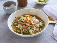 a white bowl filled with soup on top of a table