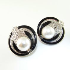 An opulent pair of retro circa 1980 fine pearl, white diamond and enamel earrings in luxurious solid 18K yellow gold. These beautiful earrings dating to the 1980s have clear references in their bold design to the roaring 1920s. True to 1980s glamour they are big and bold. Like so much absolutely high end jewelry they honestly look so luxurious it's initially a little hard to comprehend that these are out of this world precious jewels and not costume jewelry. The fine white diamonds catch the lig 1980s Glamour, Pearl Diamond Earrings, Dramatic Earrings, Statement Earrings Wedding, Pearl Statement Earrings, Retro Earrings, White Pearl Earring, Modernist Jewelry, Mabe Pearl