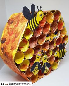 a bunch of cups that have been made to look like bees and honeybees