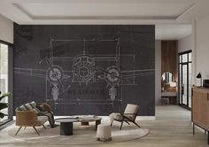 a drawing of an airplane on a wall in a living room with chairs and tables