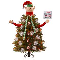 a christmas tree with an elf holding a sign